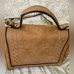 Small tan with dot of gold purse.  Very little use but in great condition.